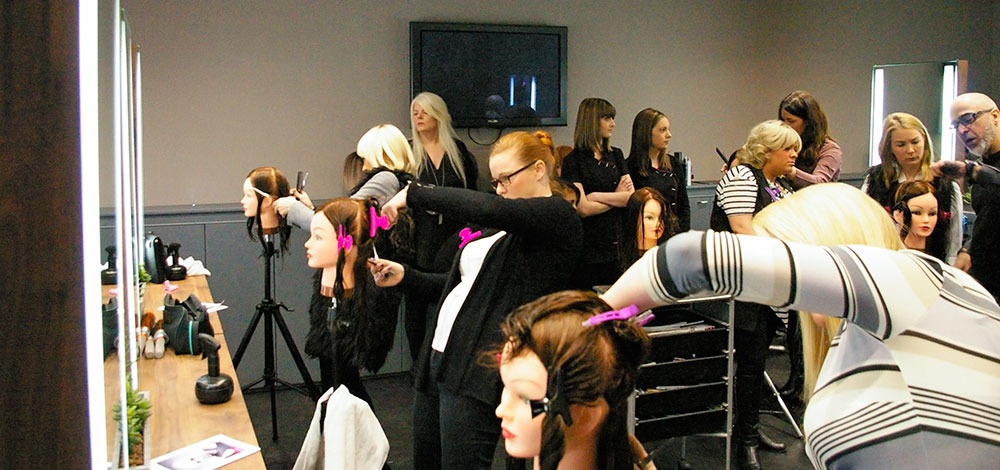 Trying out the latest styles at Eltham salon training